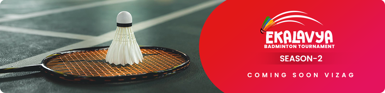 Close-up of a badminton racket head against a dark studio backdrop
